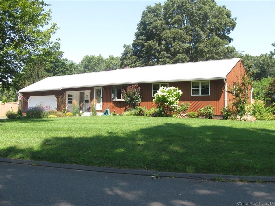 Front view of home with beautiful landscaping.