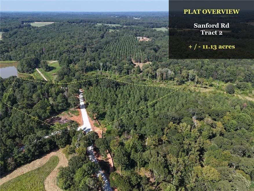 Birds eye view of property with a forest view