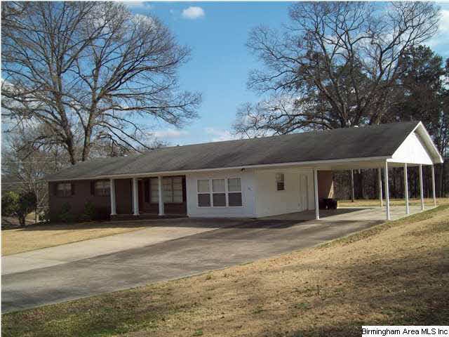 Front of home showing extra large carport