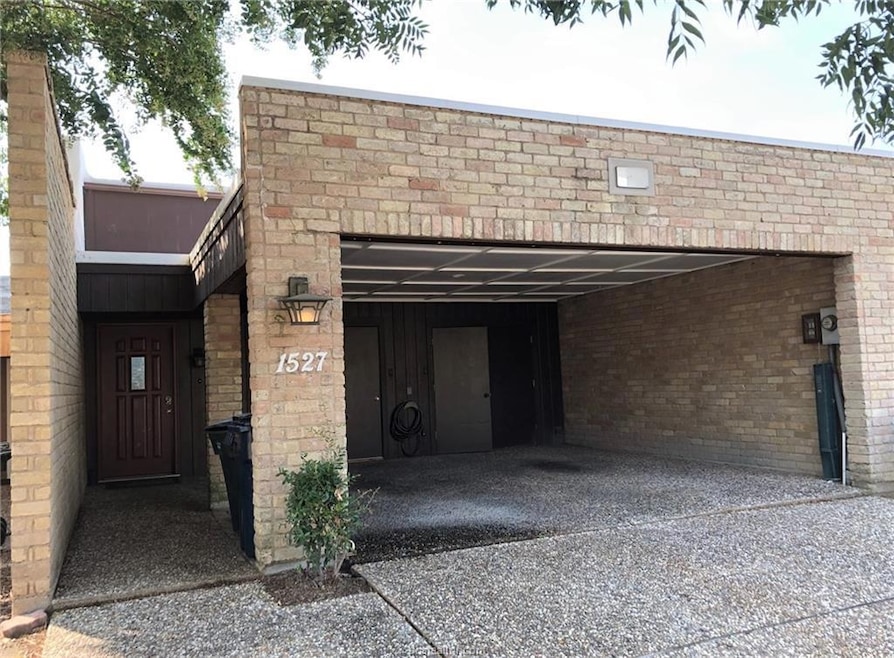 Garage featuring driveway