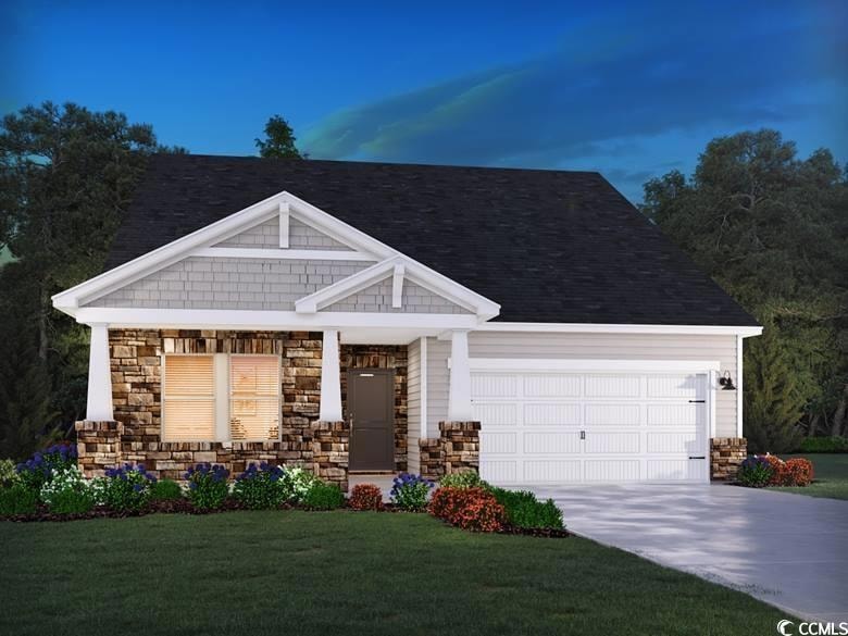 View of front of home with a garage, concrete driv