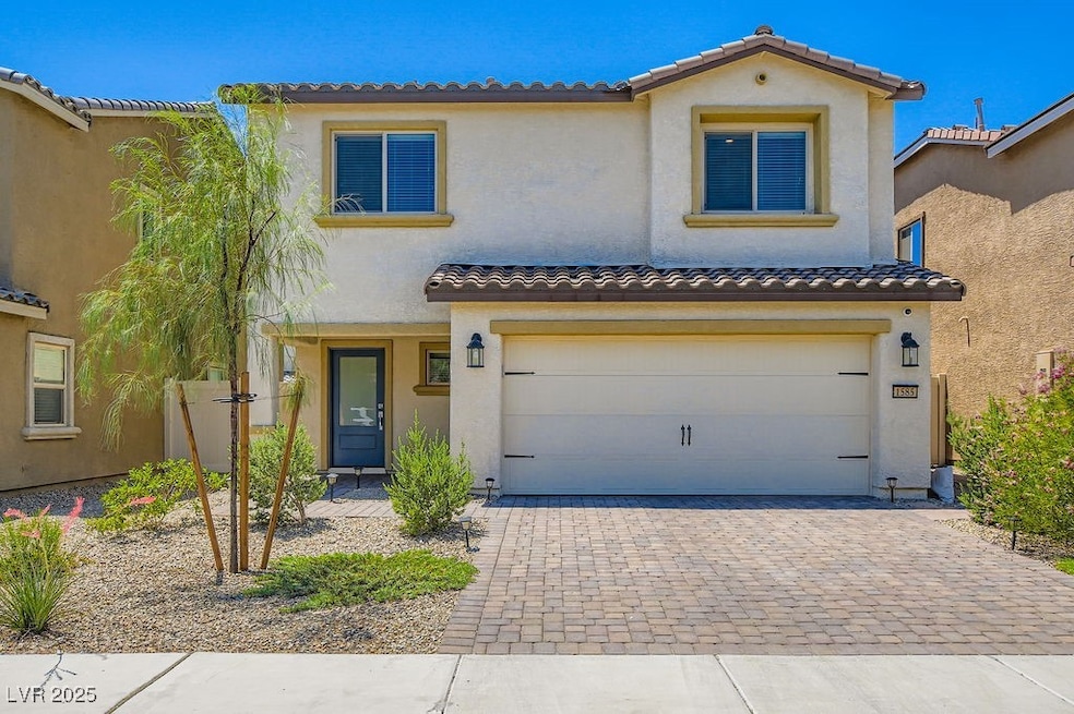 Mediterranean / spanish house featuring stucco siding, driveway, and an attached garage