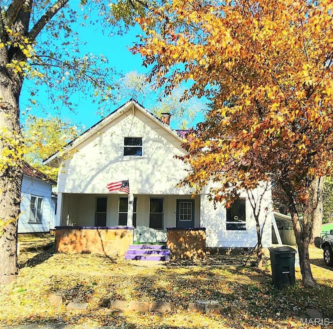 View of front of home with a chimney