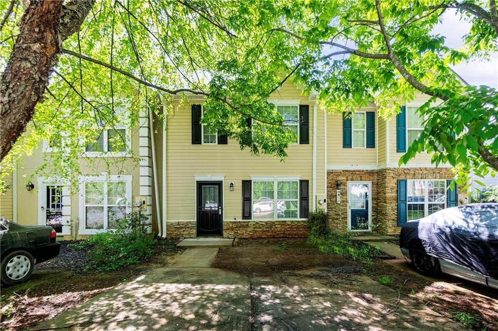 Colonial-style house with stone siding