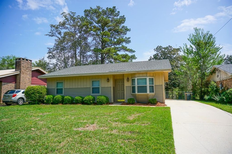 Single story home with board and batten siding, a 