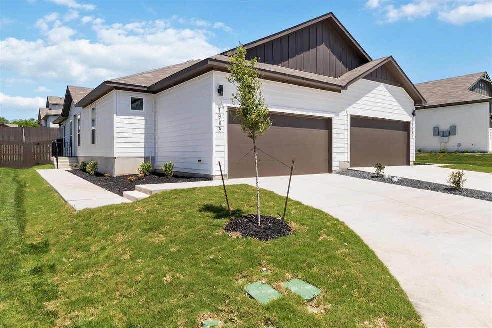 View of front of house with an attached garage, b