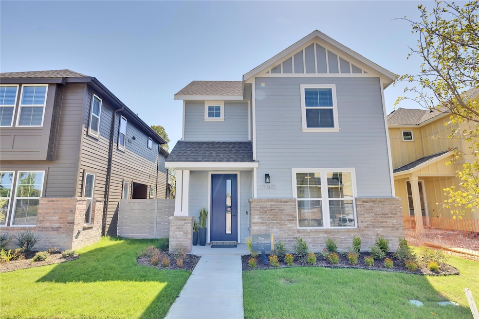 Craftsman-style house featuring brick siding, a sh