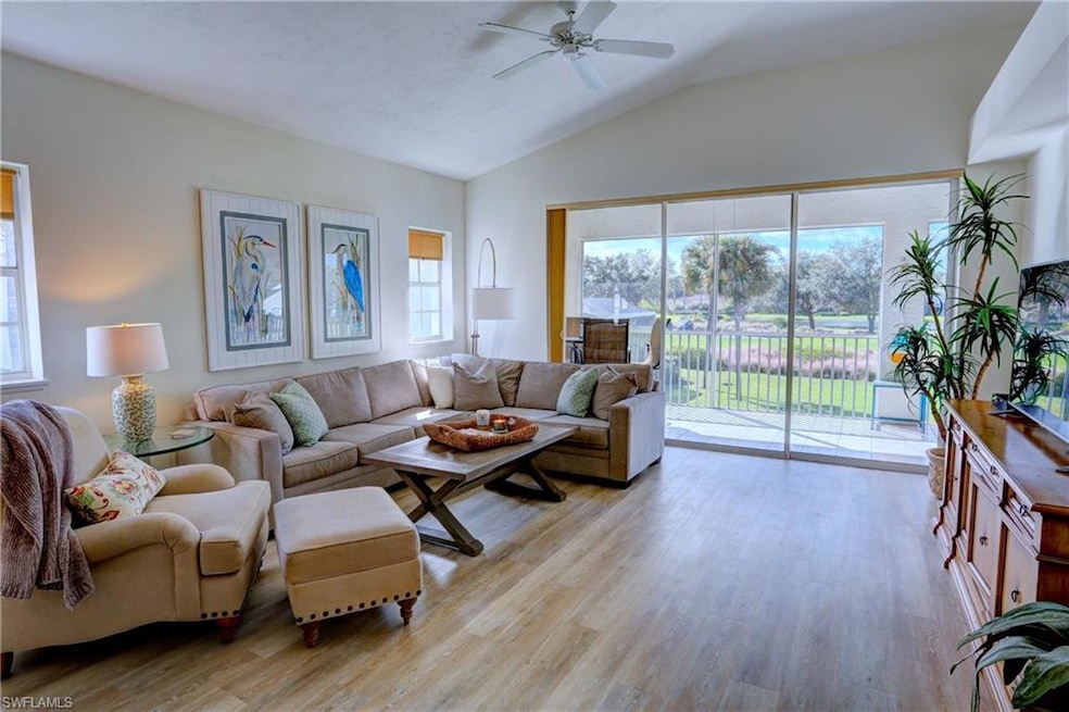 Living room featuring ceiling fan, plenty of natur