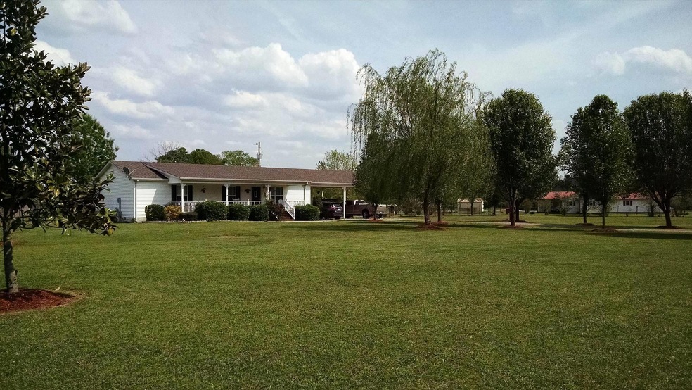 beautiful home with large well landscaped yard 