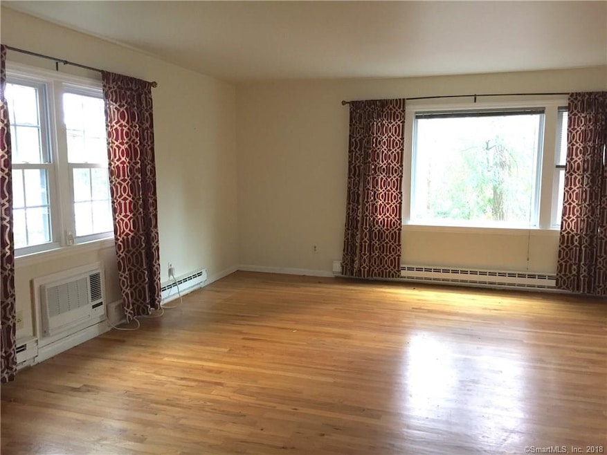 Large living room with hardwood flooring