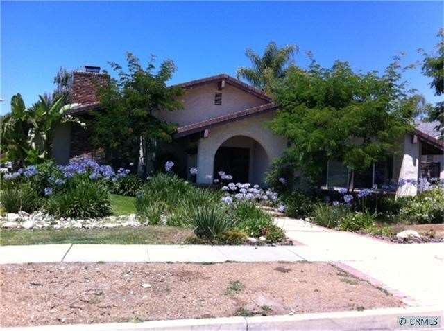 Front of Home- Large corner lot, plush landscaping