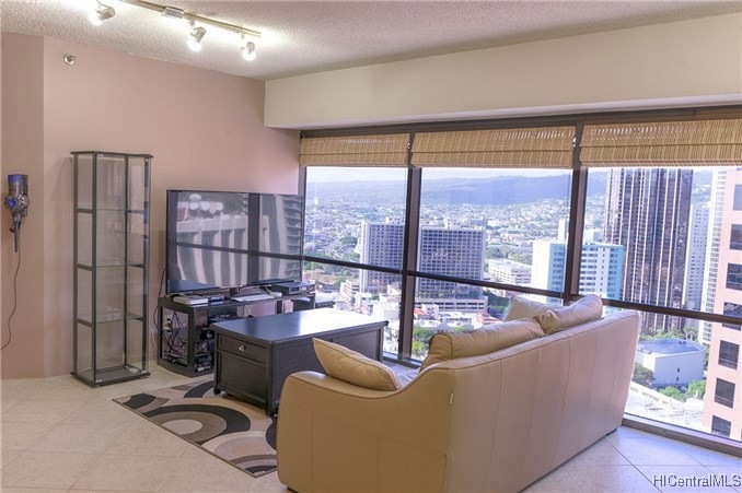 Living room with mountain and downtown views