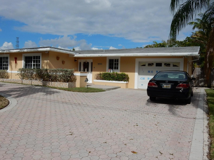 Front with pavered driveway