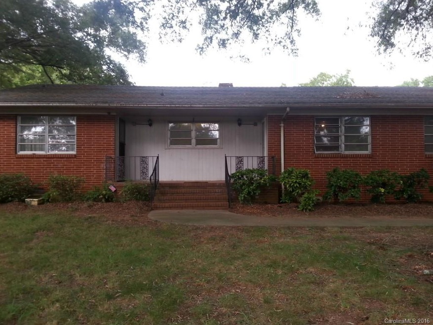 All brick ranch with 5 acres - property can be subdivided.