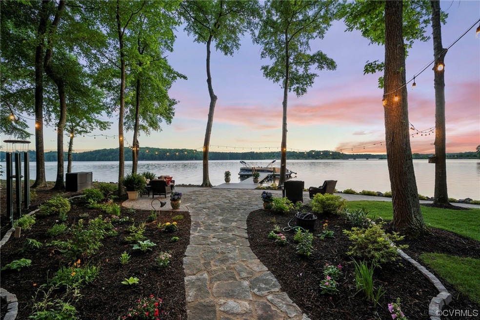 Waterfront with dock. Rear patio, exterior string