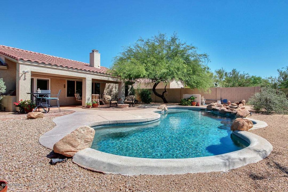 Pool with lush landscape