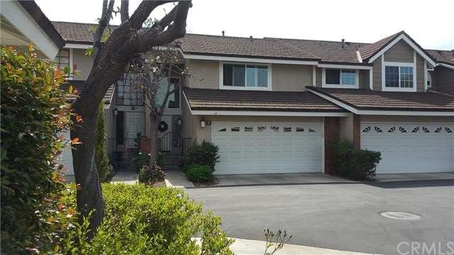 Front view with newer garage door and custom locki
