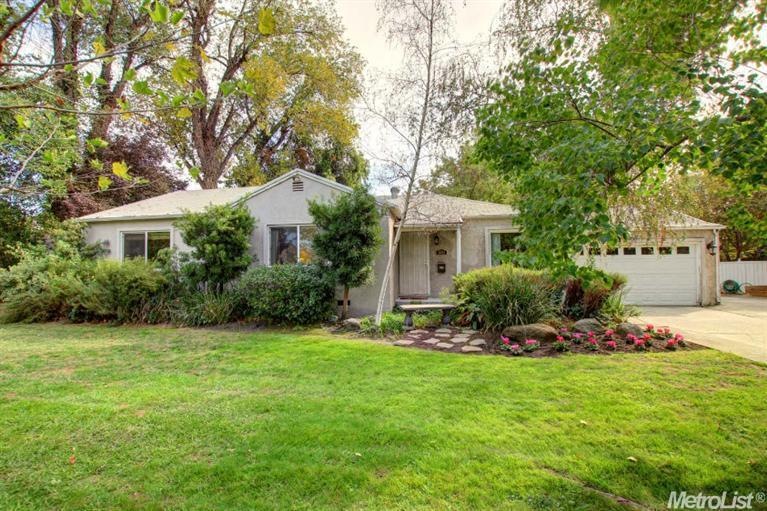 Wonderful curb appeal. Home tucked back off the street on park-like lot. Beautiful.