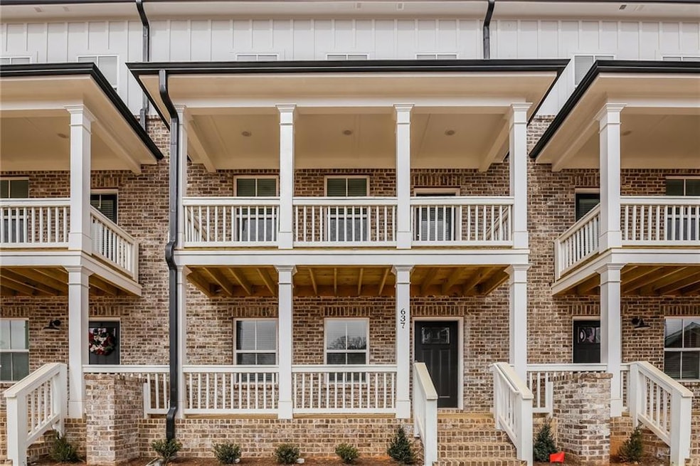 Entrance to property with brick siding, board and 