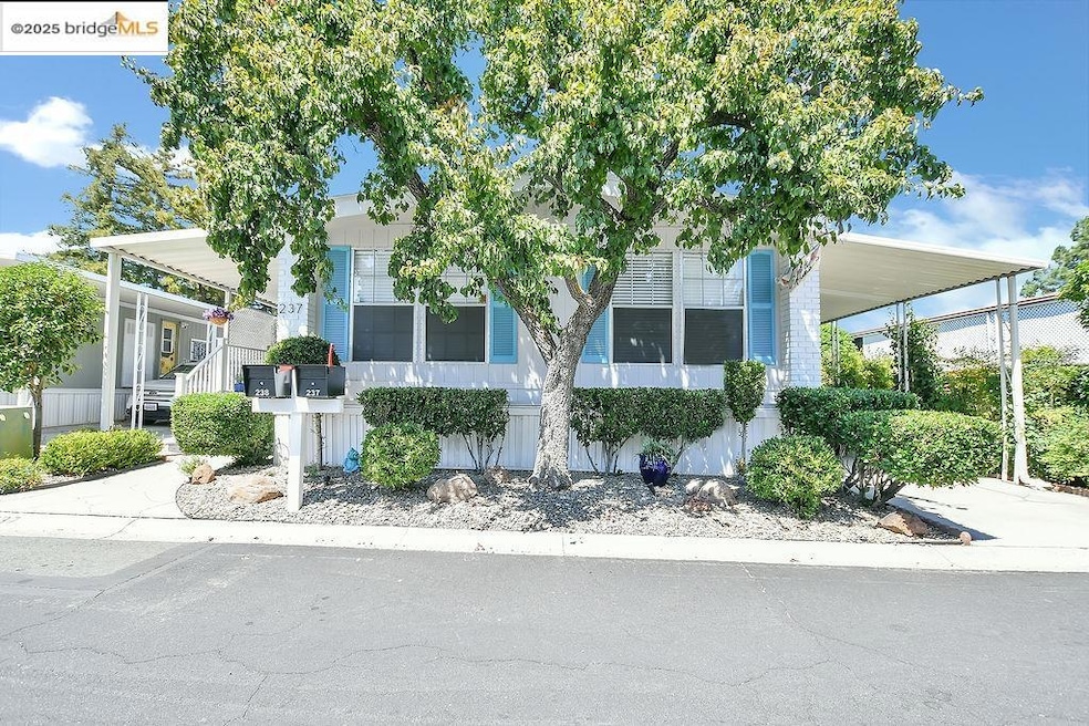 View of front facade with an attached carport