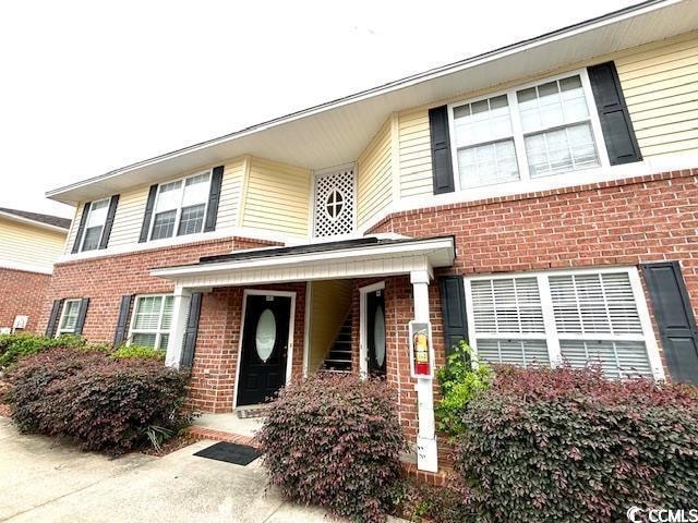 View of front of home with brick siding