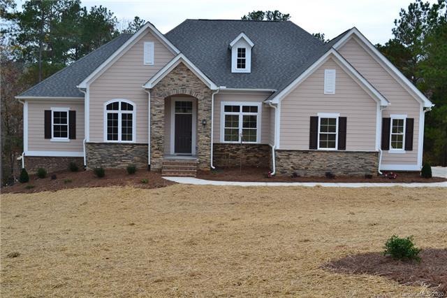 A tasteful mix of stone, brick and fiber cement si