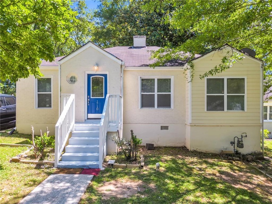 Bungalow-style home with a front yard