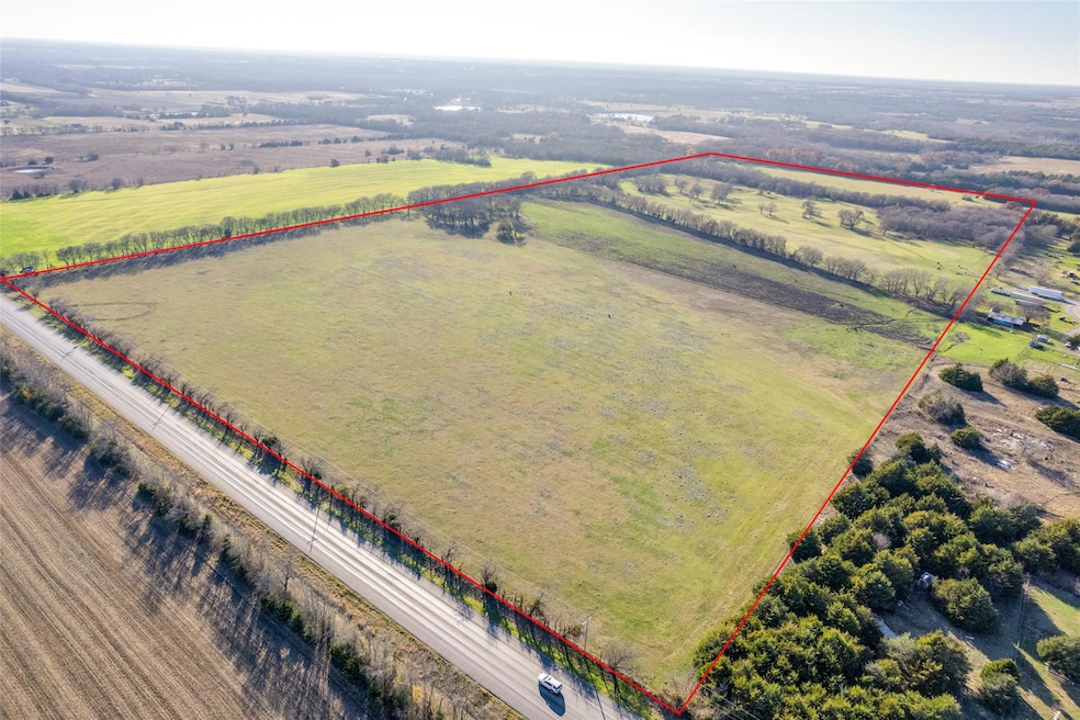 Birds eye view of property featuring a rural view