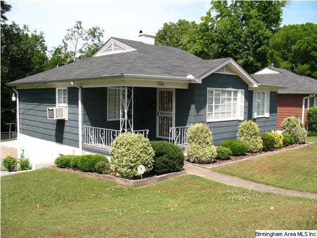 Angle view of front.  Yard is deep with rear entra