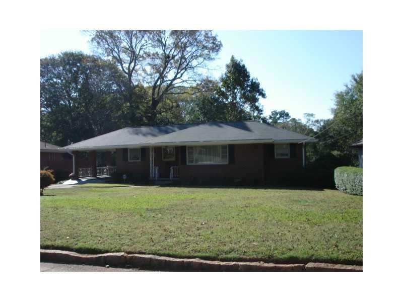 Exterior Front. Classic 4 sided brick ranch loving