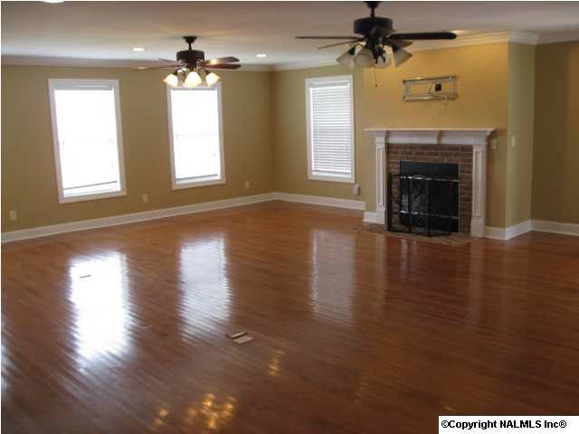 GIGANTIC GREATROOM WITH GLEAMING HARDWOODS AND COZY FIREPLACE