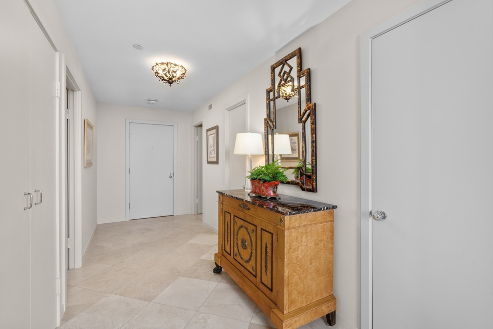 This spacious entry has porcelain tile flooring, powder bath and storage closets. Numerous updates throughout this home include fresh carpet, paint, Elfa shelving, 2023 GE stacked washer/dryer, 2018 thermostat and Hunter Douglas remote controlled blackout shades, on all windows. Move-in ready!