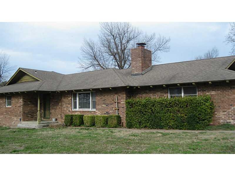 Exterior Front. House faces Colcord Avenue.  Side-
