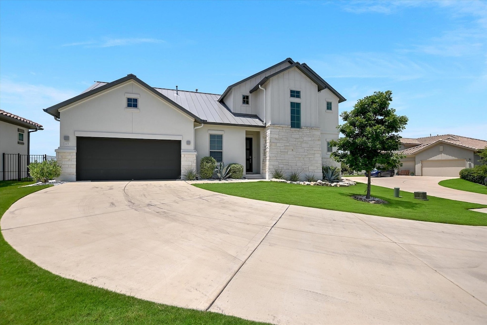 Modern inspired farmhouse featuring stone siding,