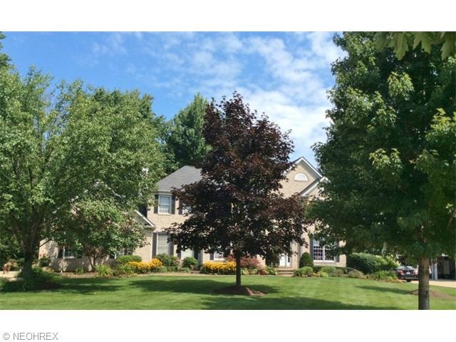 Classic Brick, 3 Car Side Load Elevation.  Pella W
