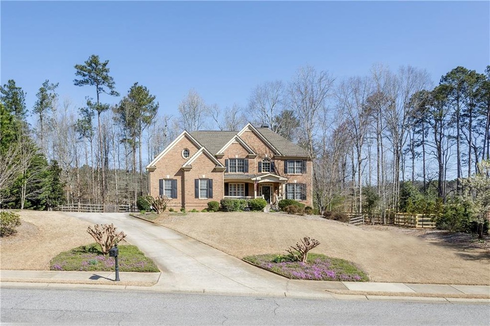 Stately brick & cement sided home situated on a be