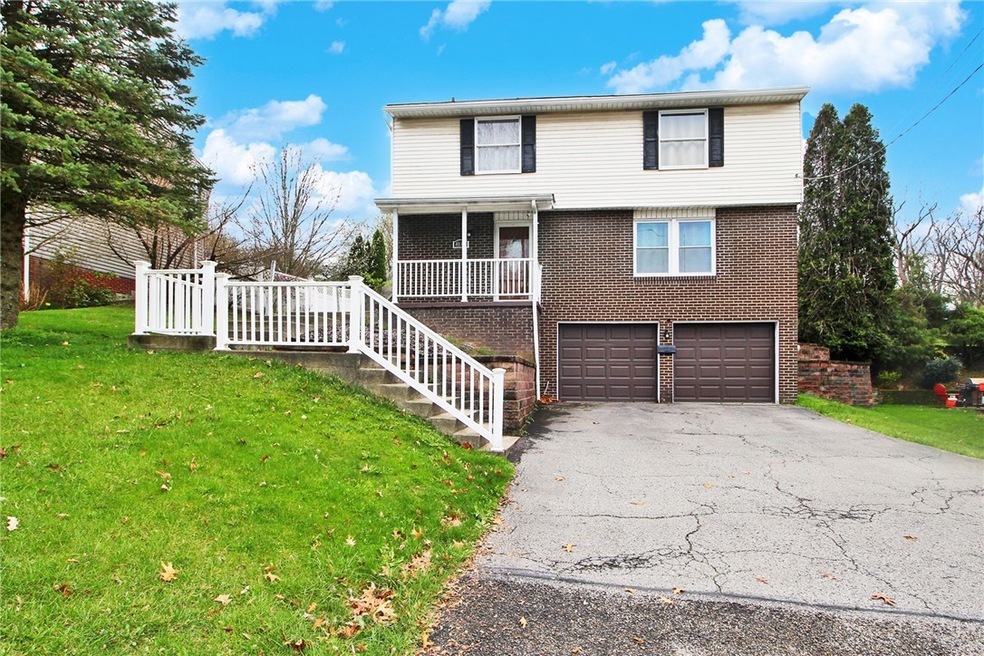Beautiful brick home with 2 car garage and plentif