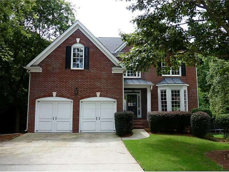 Exterior Front. beautiful 4 side brick home in cul