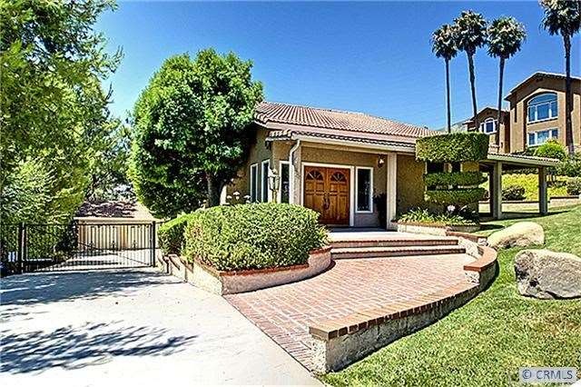 Gated entry long driveway  to detached garage. Roo