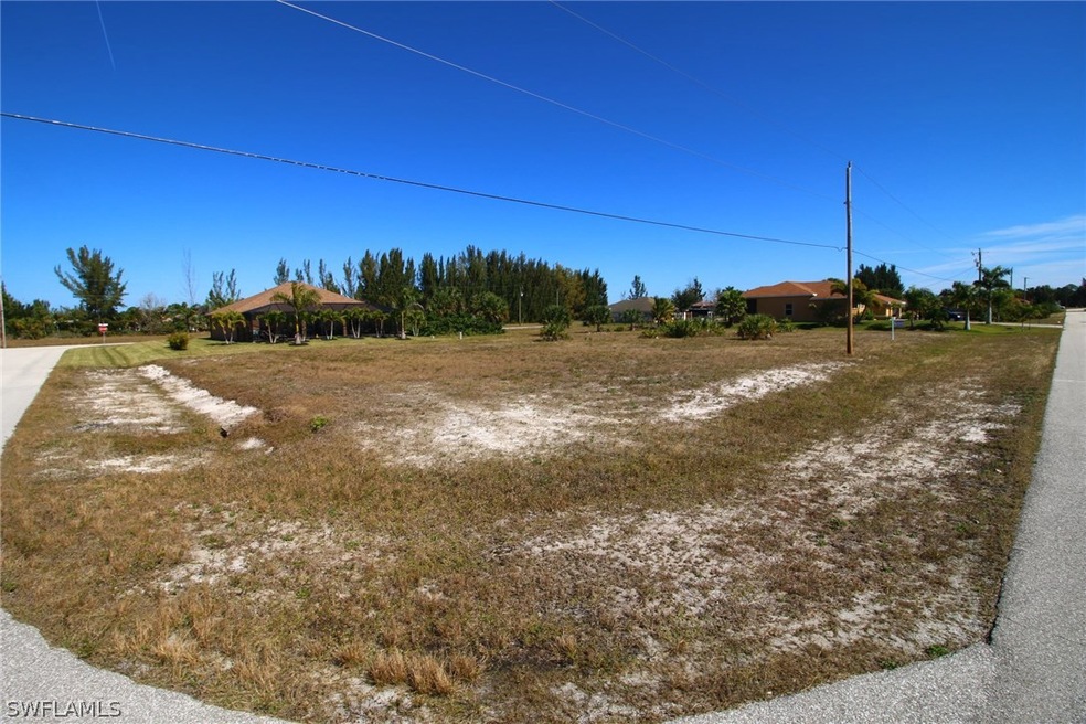 View from front SW corner of lot, with NW 21st Street on the right and NW 34th Avenue on the left.