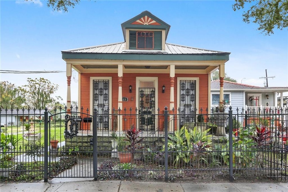 Welcome home to this covered front porch with lush