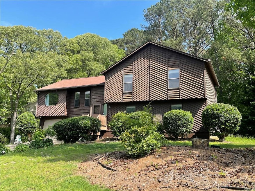 View of front of property featuring an attached ga