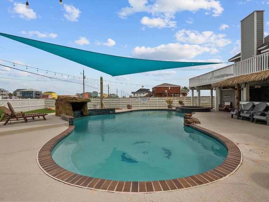 This front yard features a stylish pool with a bri
