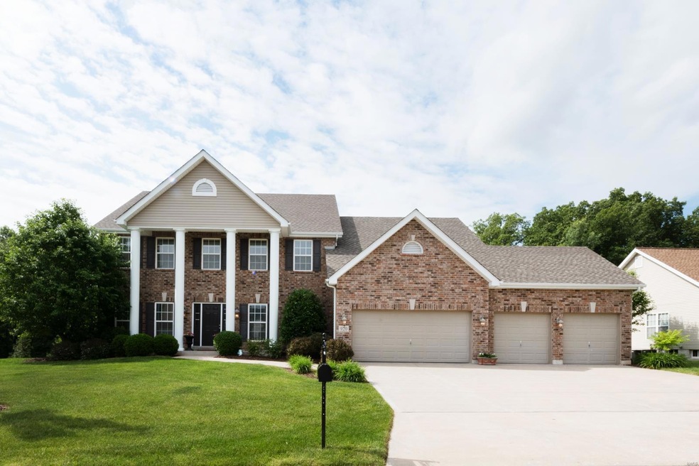 Gorgeous brick front elevation with impressive columned entry and 4-car garage!