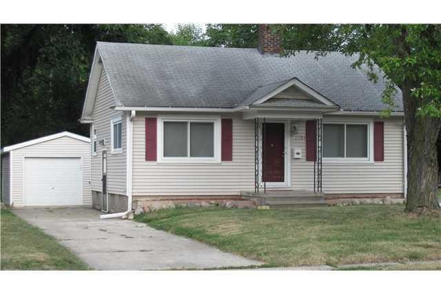 Exterior Front. Shady, level yard. Vinyl siding, n