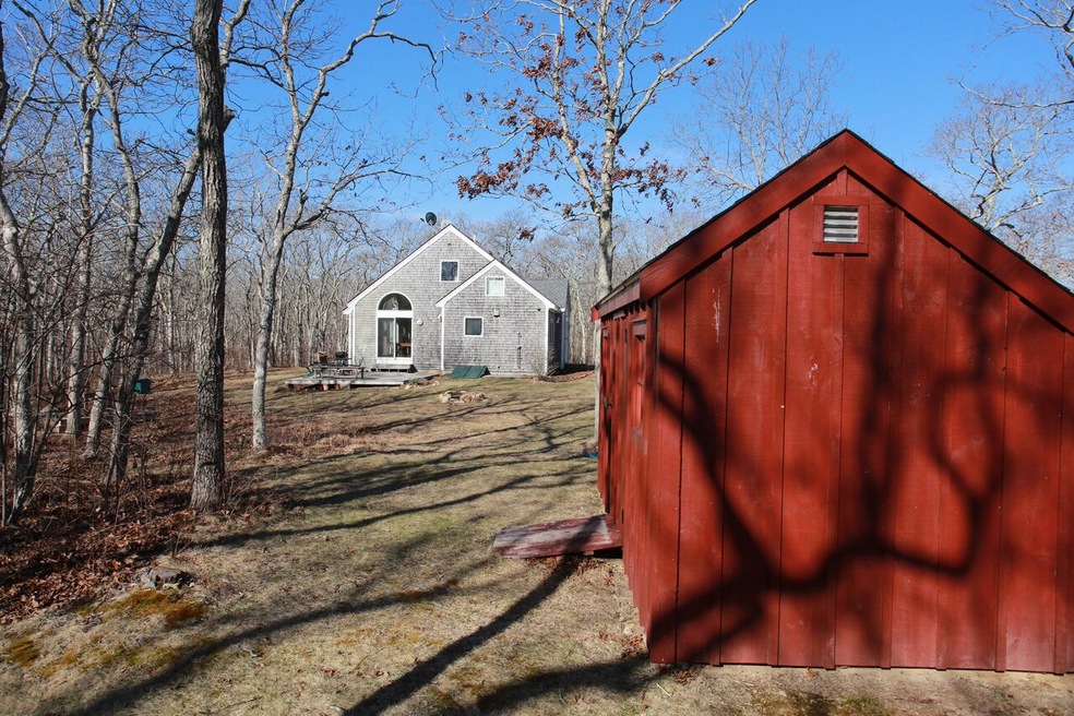 Main home with one of two storage sheds.