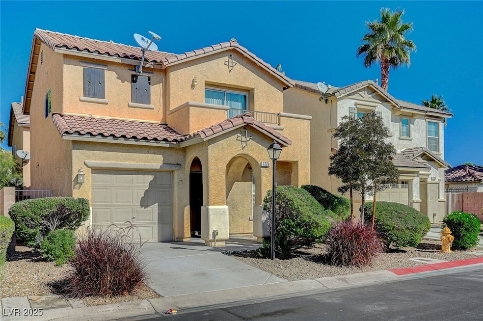 Mediterranean / spanish house featuring stucco siding, a tile roof, a garage, and driveway