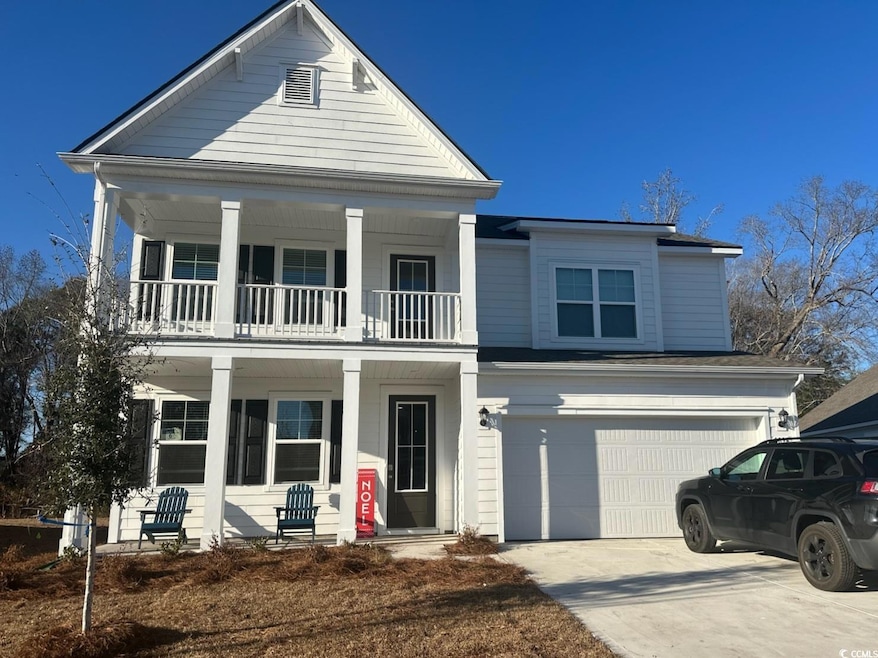 View of front of house featuring a porch, a balcon