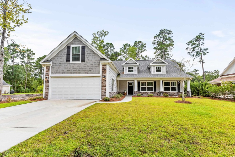 View of front of property with a front yard and a 