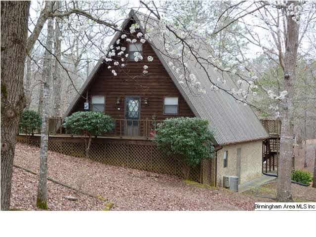 Exterior view from access road; cedar siding with 